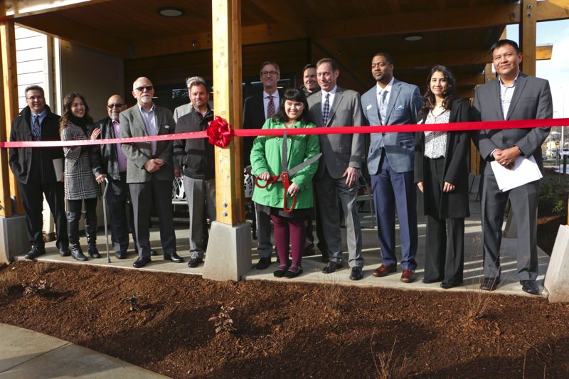 COURTESY GUARDIAN REAL ESTATE SERVICES - Tom Brenneke at the March 23 opening of NAYA Generations behind City Commissioner Dan Saltzman and next to Mayor Ted Wheeler (center, back row).